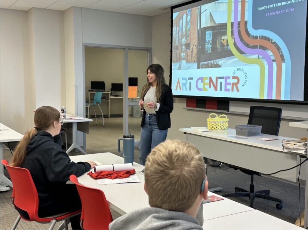 Presenter Elizabeth Pappas speaks to eighth grade students Dec. 19, 2024, about careers in the arts and the support that the Art Center of Burlington can provide. Connecting with young people in the community is a core part of the Art Center’s mission.